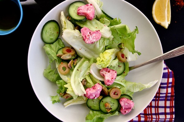 Green salad with pink goat cheese hearts
