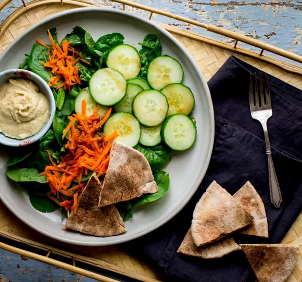 Green salad with pita bread and hummus