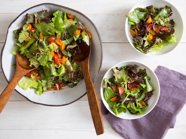 Green salad with tomatoes, scallions, and toasted kasha