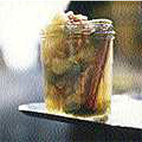Green zebra tomato jam with apples, cinnamon and walnuts