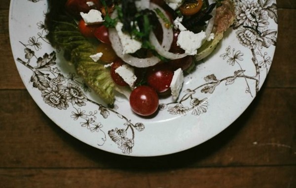 Greens and ripe tomato salad with ricotta salata and balsamic vinaigrette