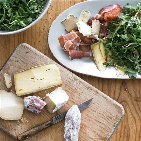 Greens with artisanal cheese and charcuterie