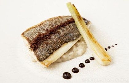 Grey mullet with pearl barley pudding, black garlic and spring onion