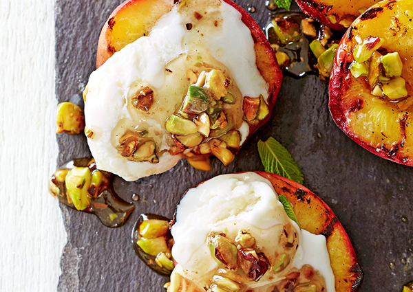 Griddled nectarines with frozen yogurt and honeyed pistachios
