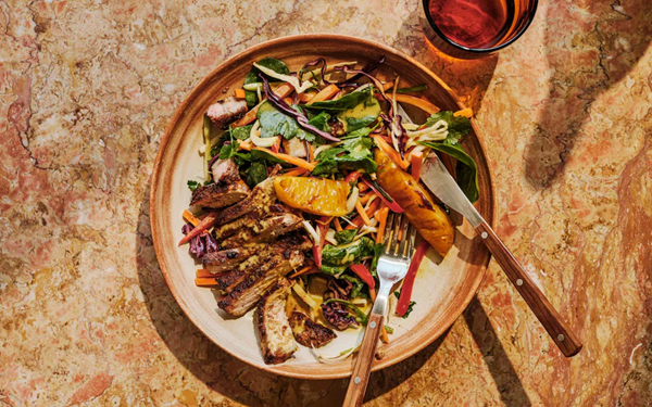 Griddled pineapple, pork, crisp vegetable and coconut salad with curry dressing