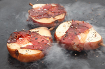 Griddled red Bartlett pears wrapped in Iberico ham