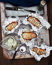 Grill-baked potatoes with chive butter
