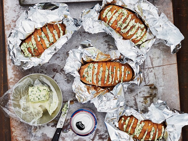Grill-baked potatoes with chive butter [Tom Mylan]