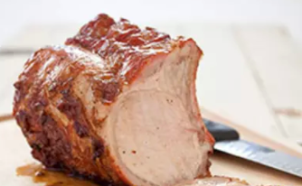 Grill-roasted bone-in pork rib roast with orange salsa