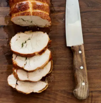 Grill-roasted boneless turkey breast with herb butter