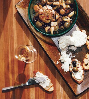 Grill-roasted garlic and olive relish with toasts and goat cheese