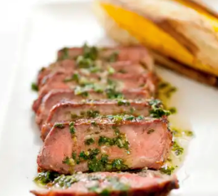 Grilled Argentinian steaks with chimichurri sauce