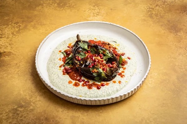 Grilled aubergine with harissa and herby yoghurt