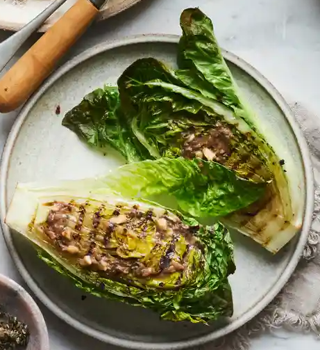 Grilled baby gem with anchovy dripping