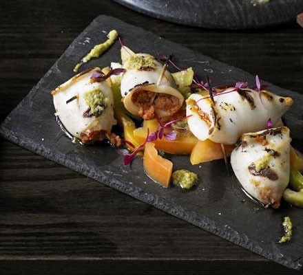 Grilled baby squid stuffed with chorizo, tomato salad and green olive tapenade