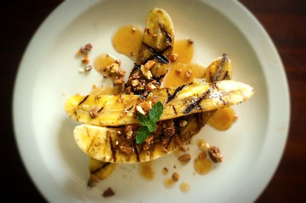 Grilled bananas with buttered maple sauce and English almond toffee