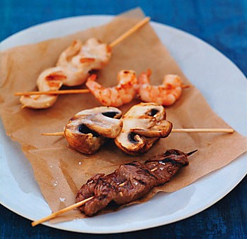 Grilled beef, chicken, shrimp, and mushroom skewers