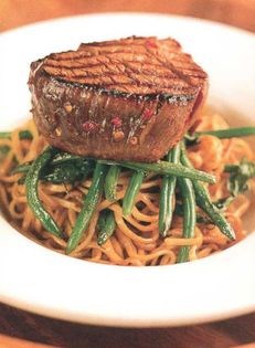 Grilled beef fillet on wok-fried noodles