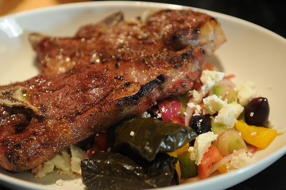 Grilled blade chops over Greek salad