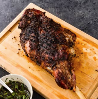 Grilled bone-in leg of lamb with charred-scallion sauce