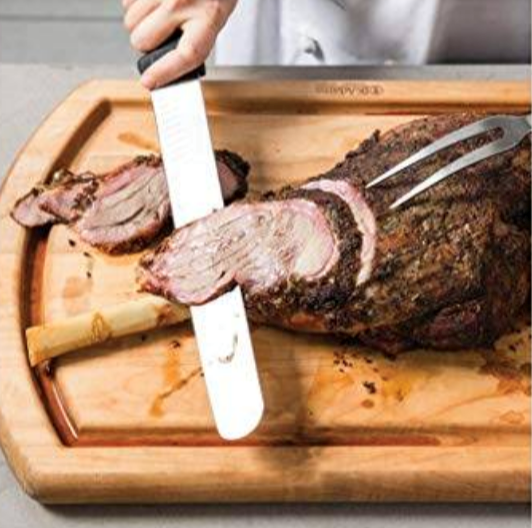 Grilled bone-in leg of lamb with charred-scallion sauce