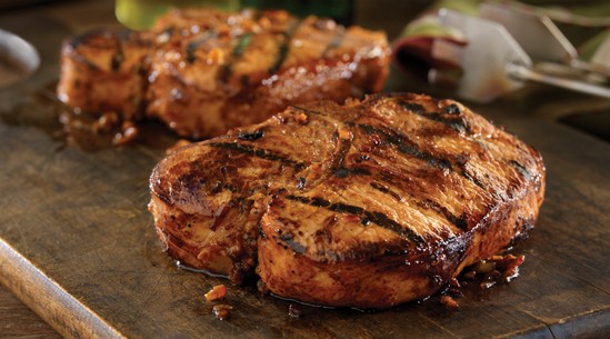 Grilled bone-in pork chops with Hawaiian marinade