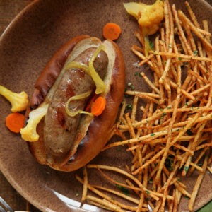 Grilled bratwurst with shoestring gremolata fries