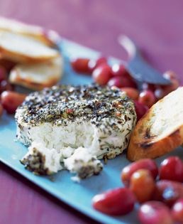 Grilled Brie wrapped in grape leaves