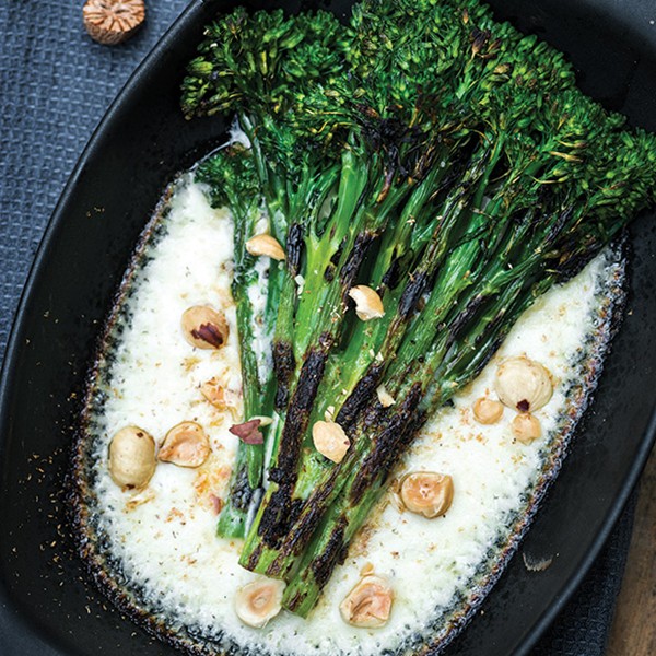 Grilled broccolini with Taleggio cream and hazelnuts