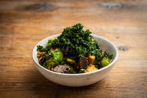 Grilled Brussels sprouts with pecan praline and sprout top seaweed
