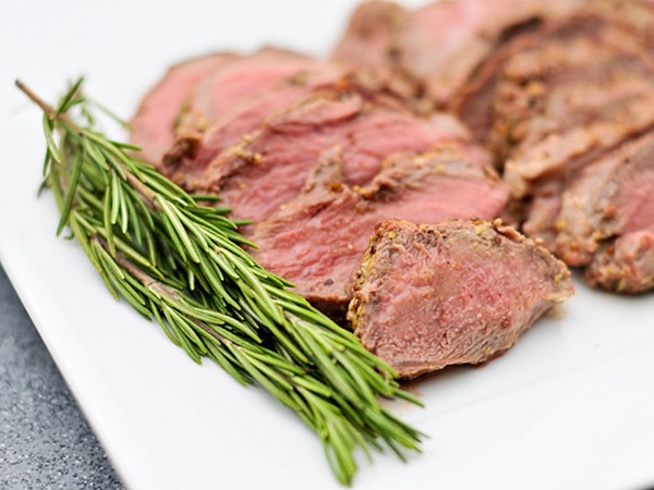 Grilled butterflied leg of lamb with rosemary, garlic, and mustard crust