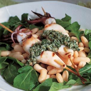 Grilled calamari on a bed of white beans
