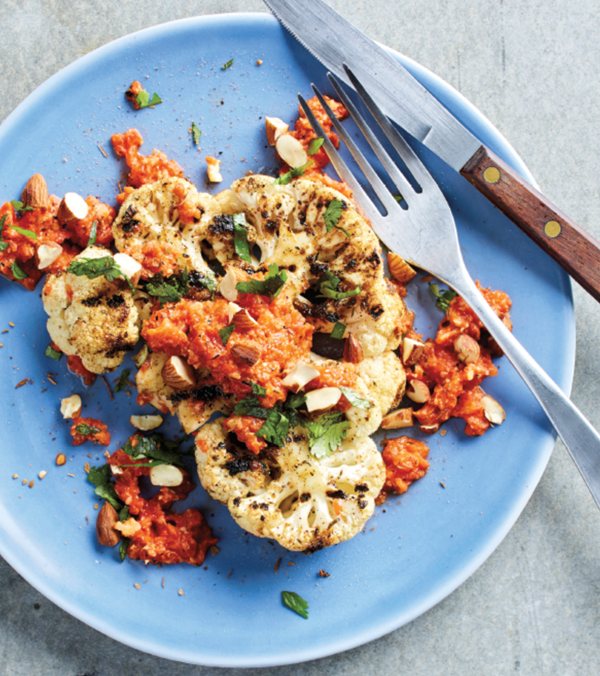Grilled cauliflower steaks with romesco sauce and toasted nuts