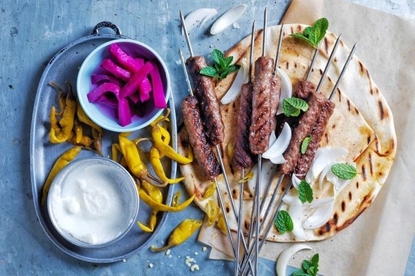 Grilled cevapi skewers with pickles