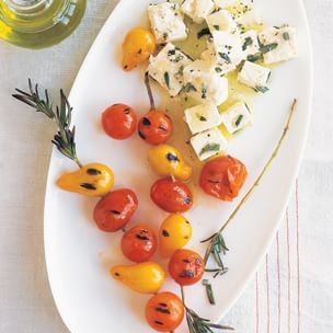 Grilled cherry tomatoes with marinated feta