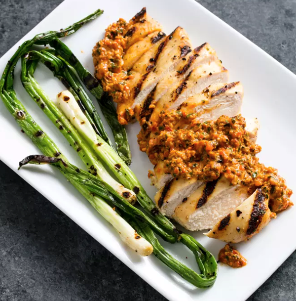 Grilled chicken and scallions with romesco
