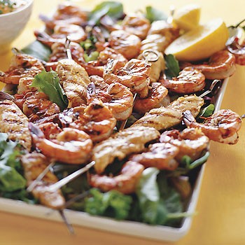 Grilled chicken and shrimp kebabs with lemon and garlic