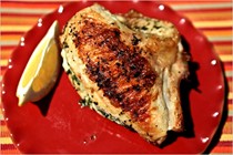 Grilled chicken breasts stuffed with herb butter