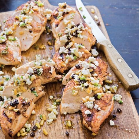 Grilled chicken breasts with feta and pine nut relish