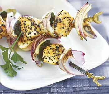 Grilled chicken, red onion, and mint kebabs with Greek salad