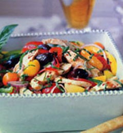 Grilled chicken salad with sweet and hot peppers, olives, and capers