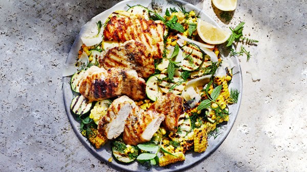 Grilled chicken thighs with charred corn and summer squash