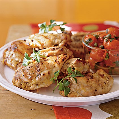 Grilled chicken thighs with roasted grape tomatoes
