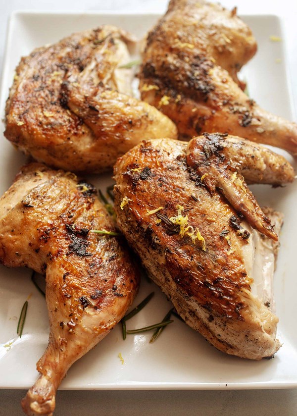 Grilled chicken under a brick 