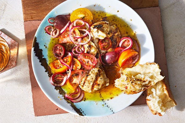 Grilled chicken with marinated tomatoes and onions