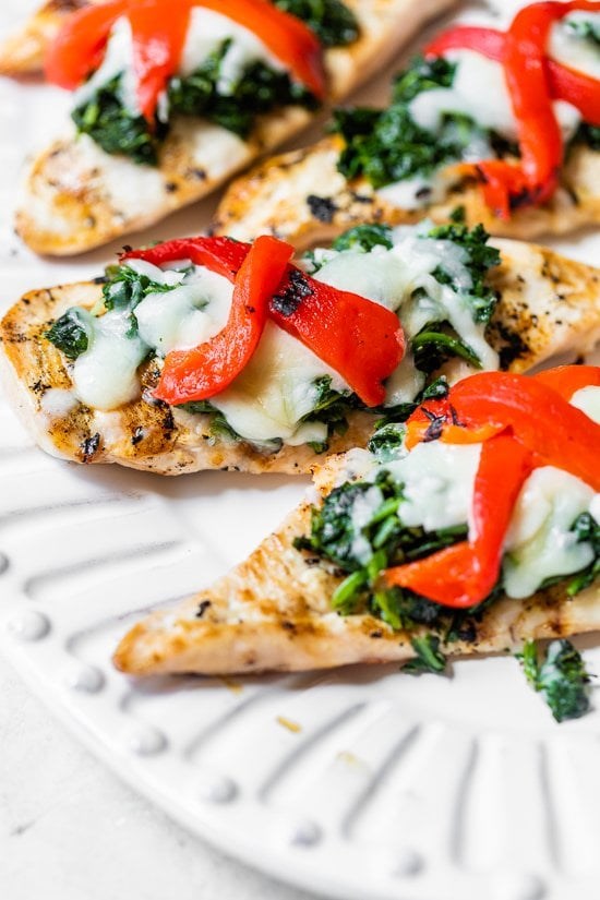 Grilled chicken with spinach and melted mozzarella