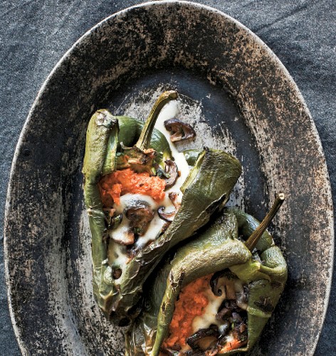 Grilled chiles rellenos stuffed with queso Oaxaca, mushrooms, and sweet potato