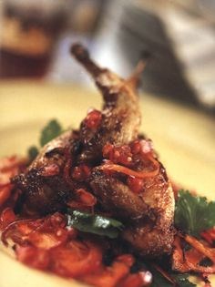 Grilled cinnamon quail on roast carrot & ginger salad with pomegranate