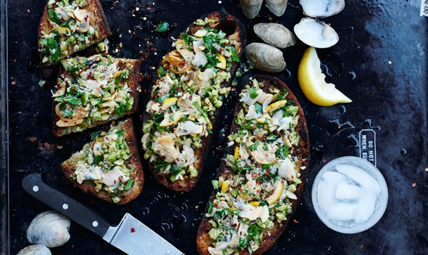Grilled clam toasts with lemon and green olives