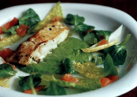 Grilled cod with bitter salad leaves and parsley dressing